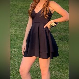 Homecoming mini dress with an open lace adorable back